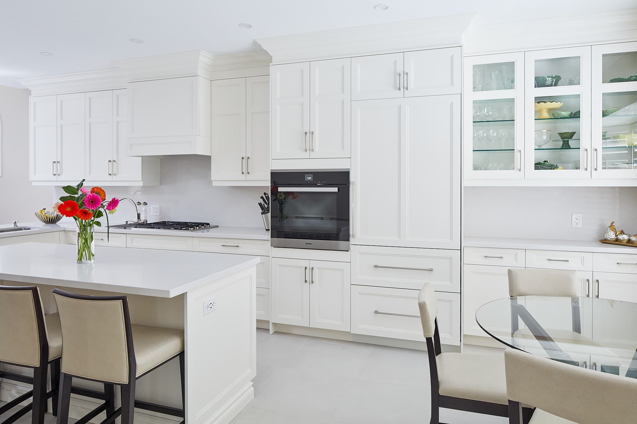 White kitchen cabinetry and island by Harbour Kitchens