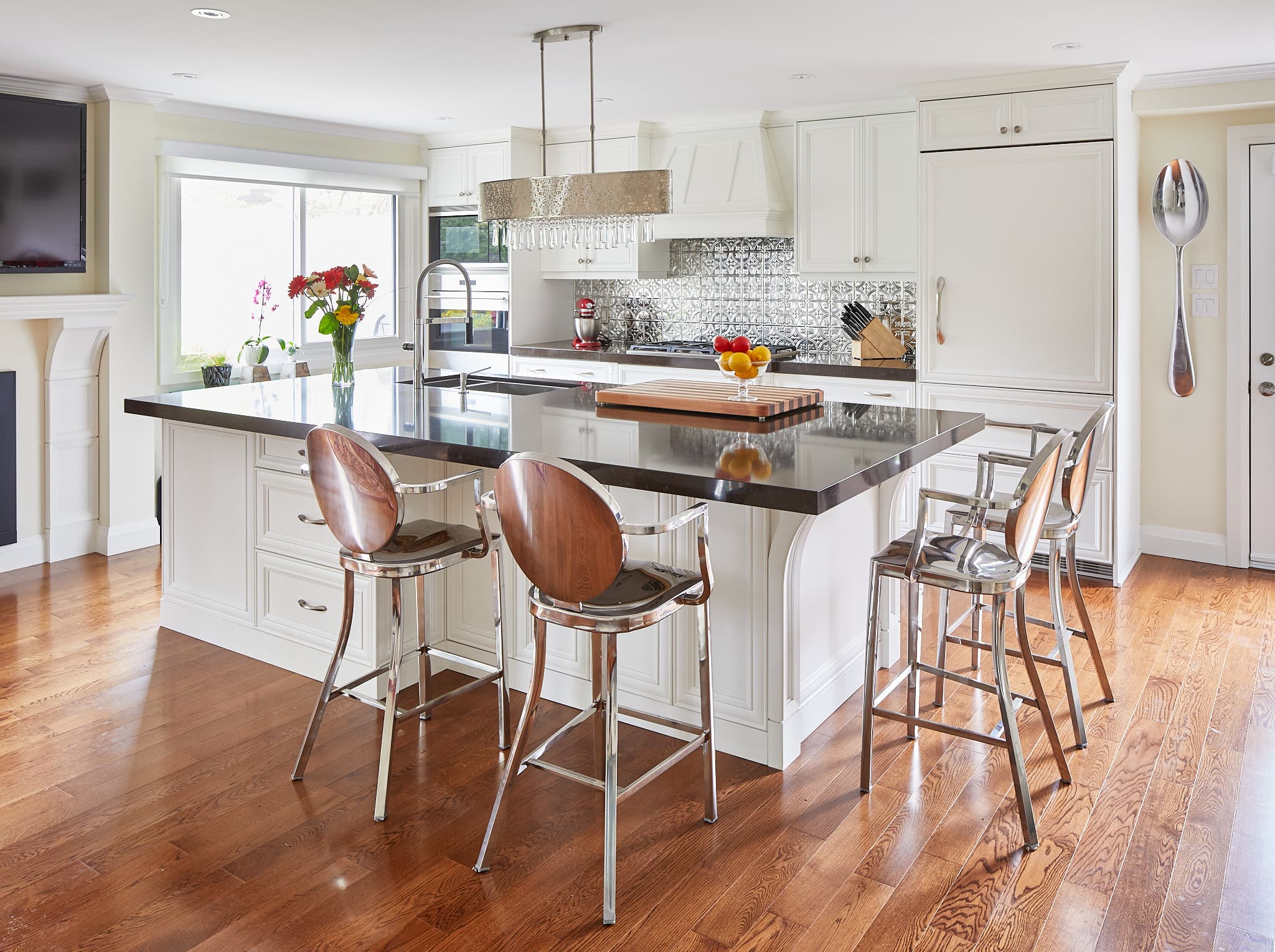 Kitchen island and cabinetry by Harbour Kitchens