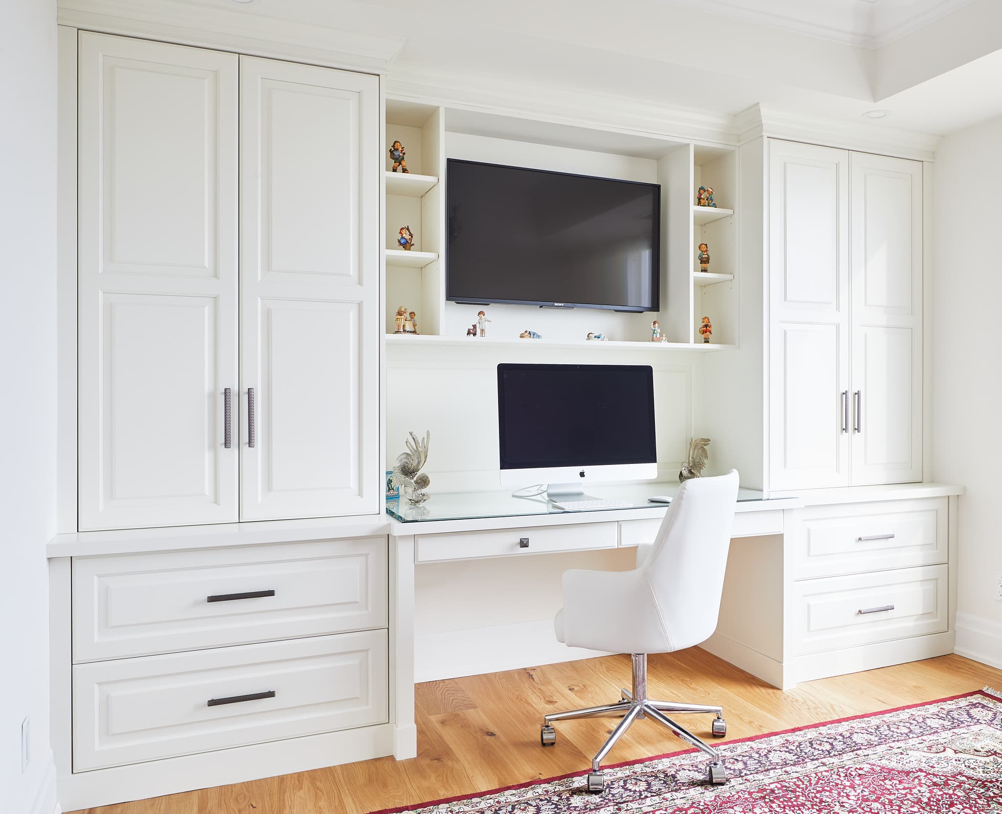 Custom cabinetry and built-in storage by Harbour Kitchens